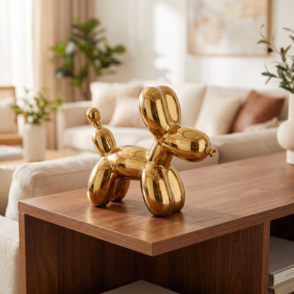 Golden Balloon Dog Sculpture styled on a console shelf
