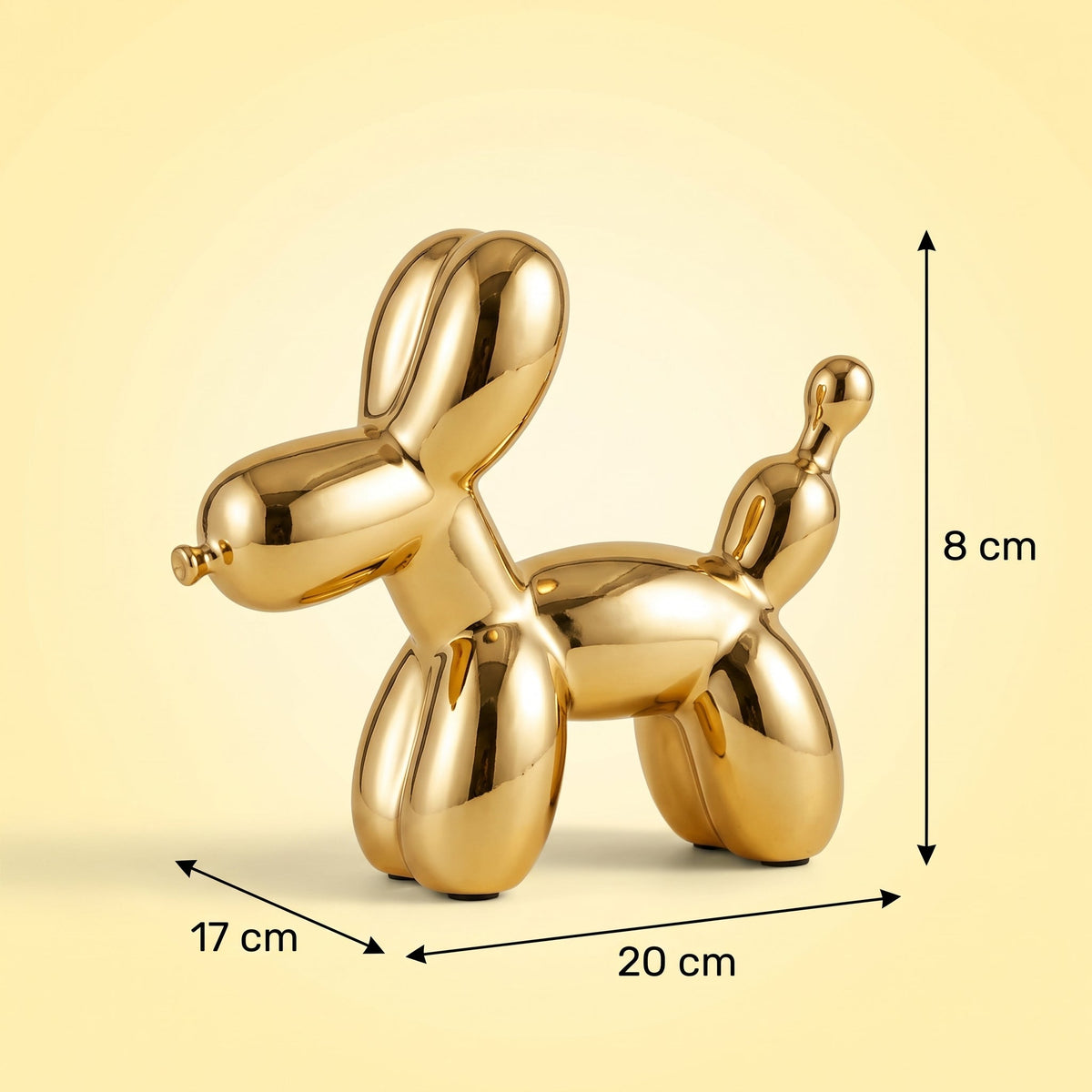 Golden Balloon Dog Sculpture — dimensions 20 x 17 x 8 cm