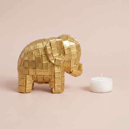 Gold Patterned Elephant Accent side profile shown with a tealight candle for scale