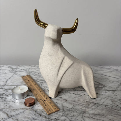 Aureus Bull Sculpture shown with a tealight candle for scale