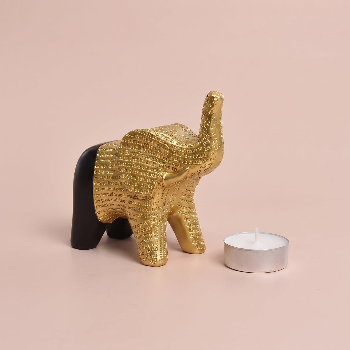 Dual-Tone Textured Elephant Figurine shown with a tealight candle for scale