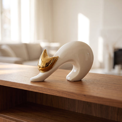 Golden Grace Abstract Sculpture styled on a console shelf