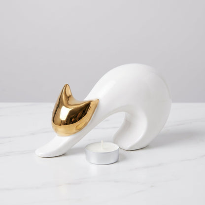 Golden Grace Abstract Sculpture shown with a tealight candle for scale