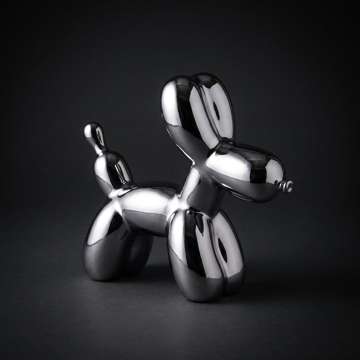 Silver Balloon Dog Sculpture — full view on dark background