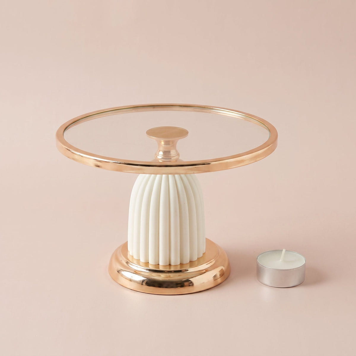 Ivory Luxe Cake Display Stand Regular shown with a tealight candle for scale