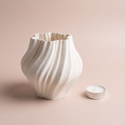 Ivory Ripple Vase shown with a tealight candle for scale