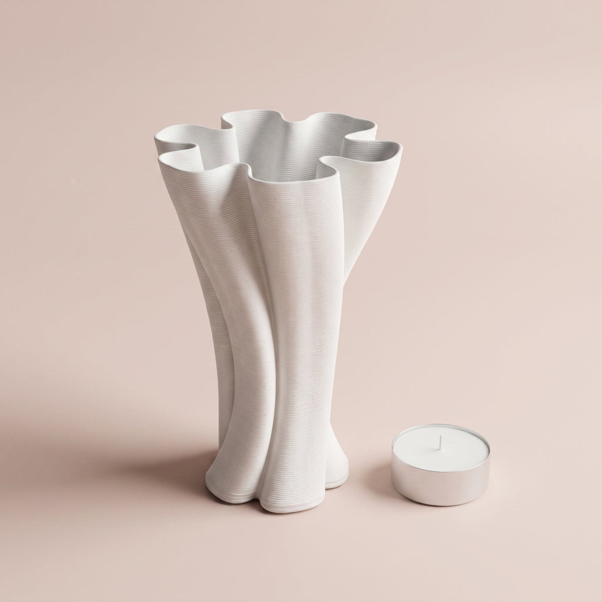 Petal Fold Vase shown with a tealight candle for scale