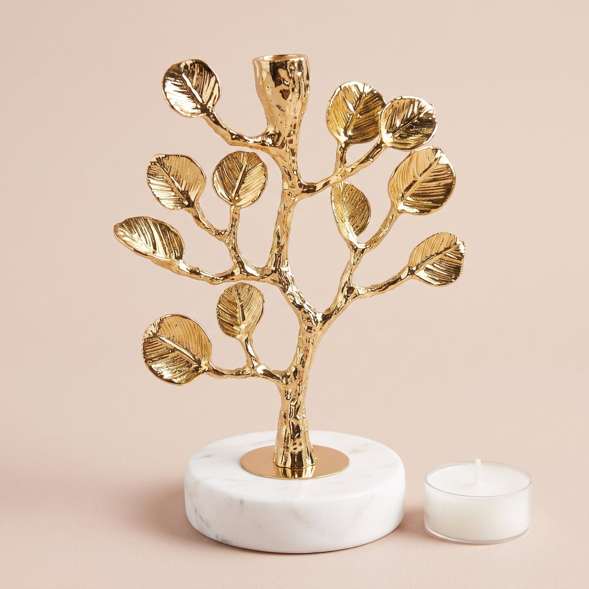 Golden Tree Candle Holder shown with a tealight candle for scale