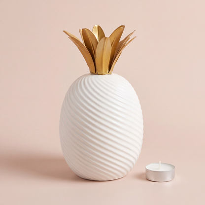 Ribbed White Pineapple Decor Accent side profile shown with a tealight candle for scale